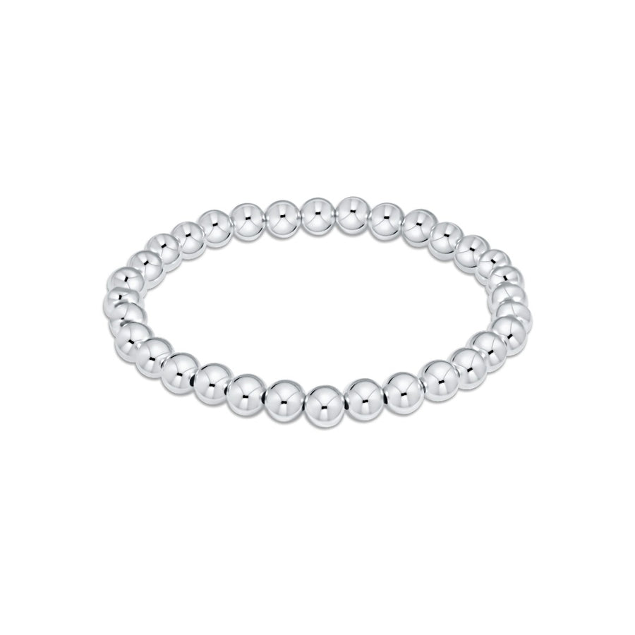 silver beaded bracelet on white background
