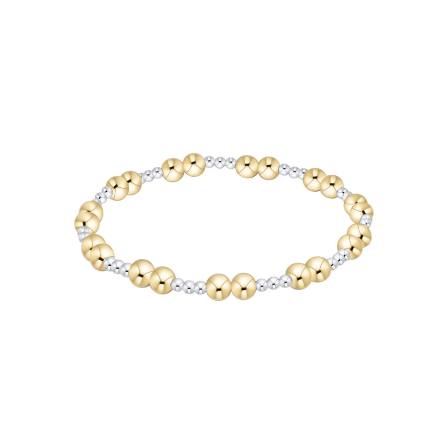 A two-tone beaded stretch bracelet featuring large polished gold beads alternating with smaller silver-toned textured beads, shown on a plain white background.