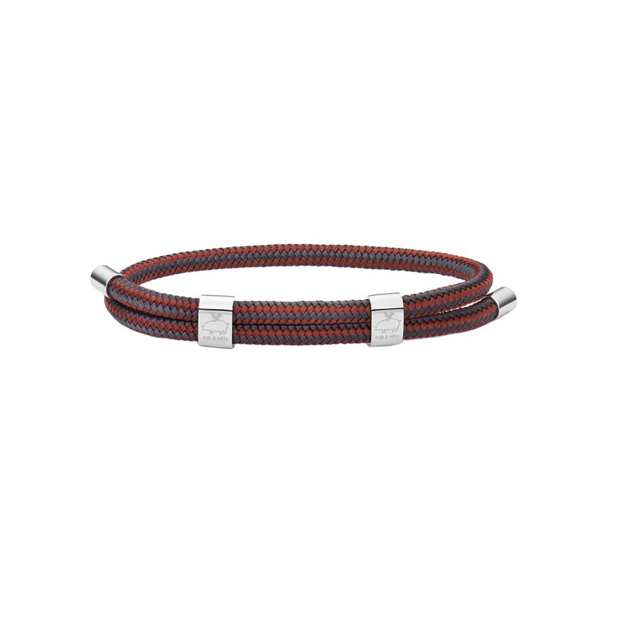 Red and gray rope bracelet with silver hardware on white background
