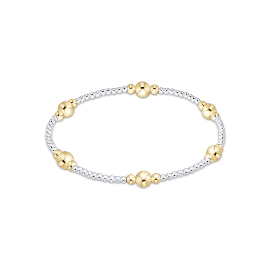 A delicate two-tone beaded bracelet featuring polished yellow gold flower-shaped beads and silver-toned round beads, displayed on a clean white background.