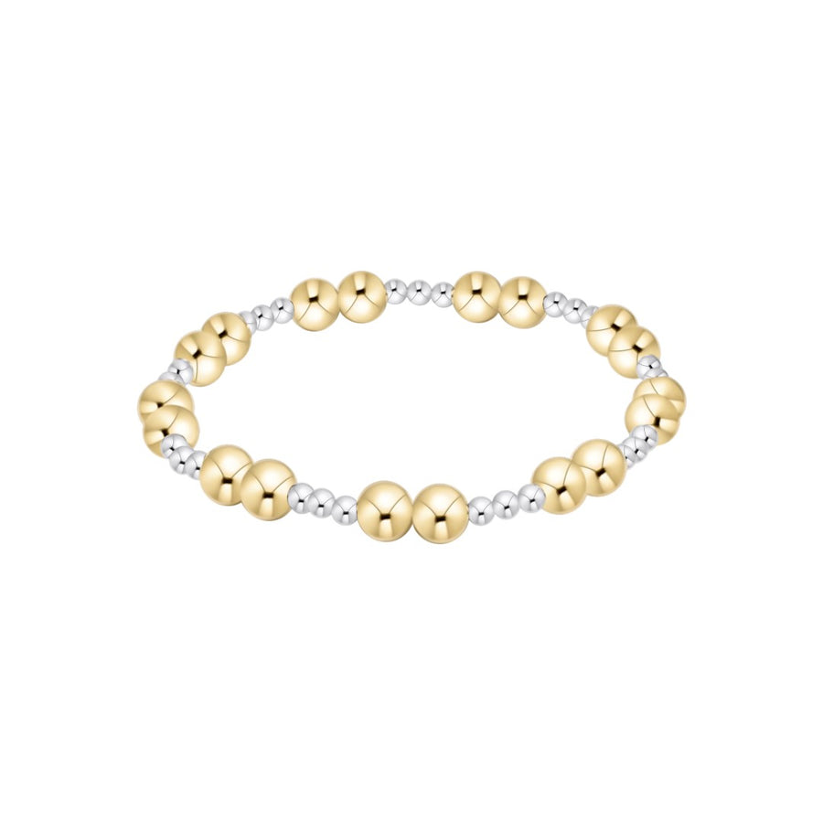 A beaded stretch bracelet featuring alternating polished yellow gold and silver metallic beads, displayed on a clean white background.