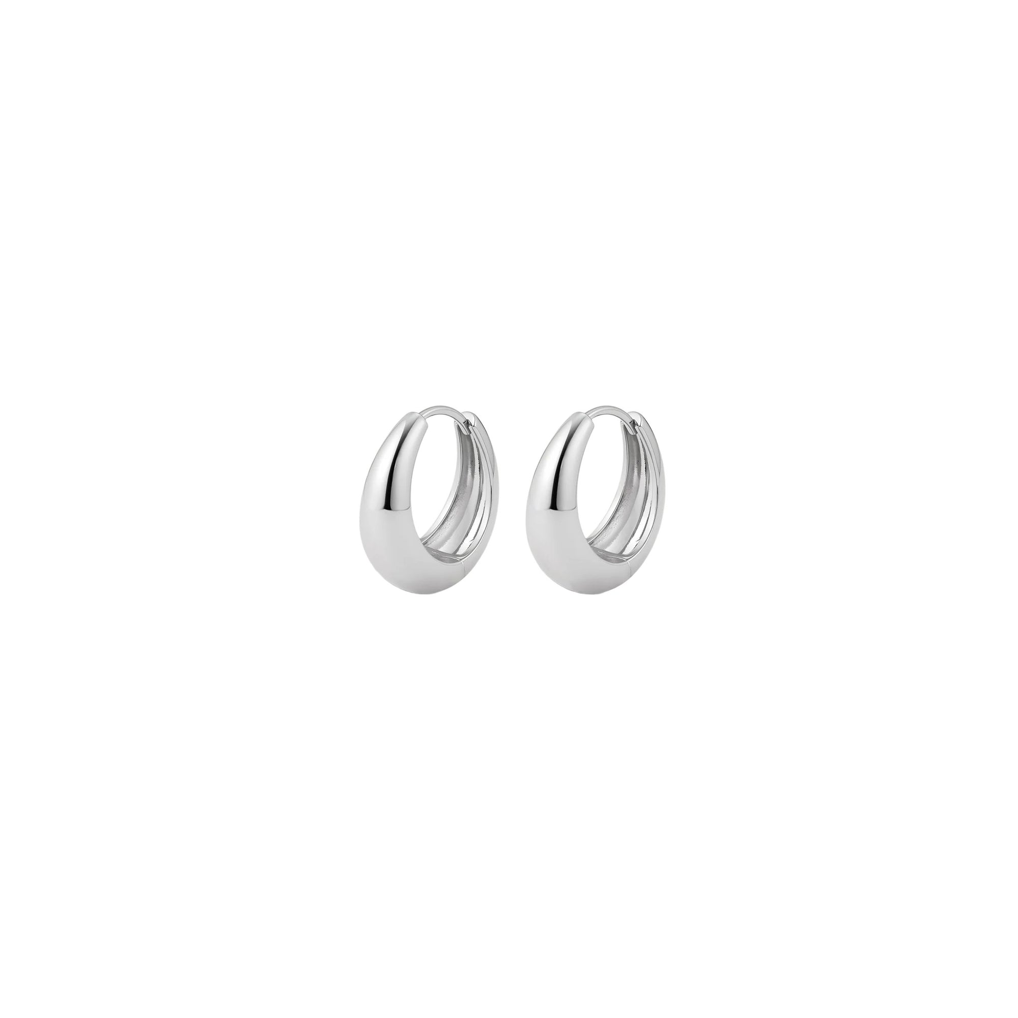 Wide graduated silver hoops on white background.