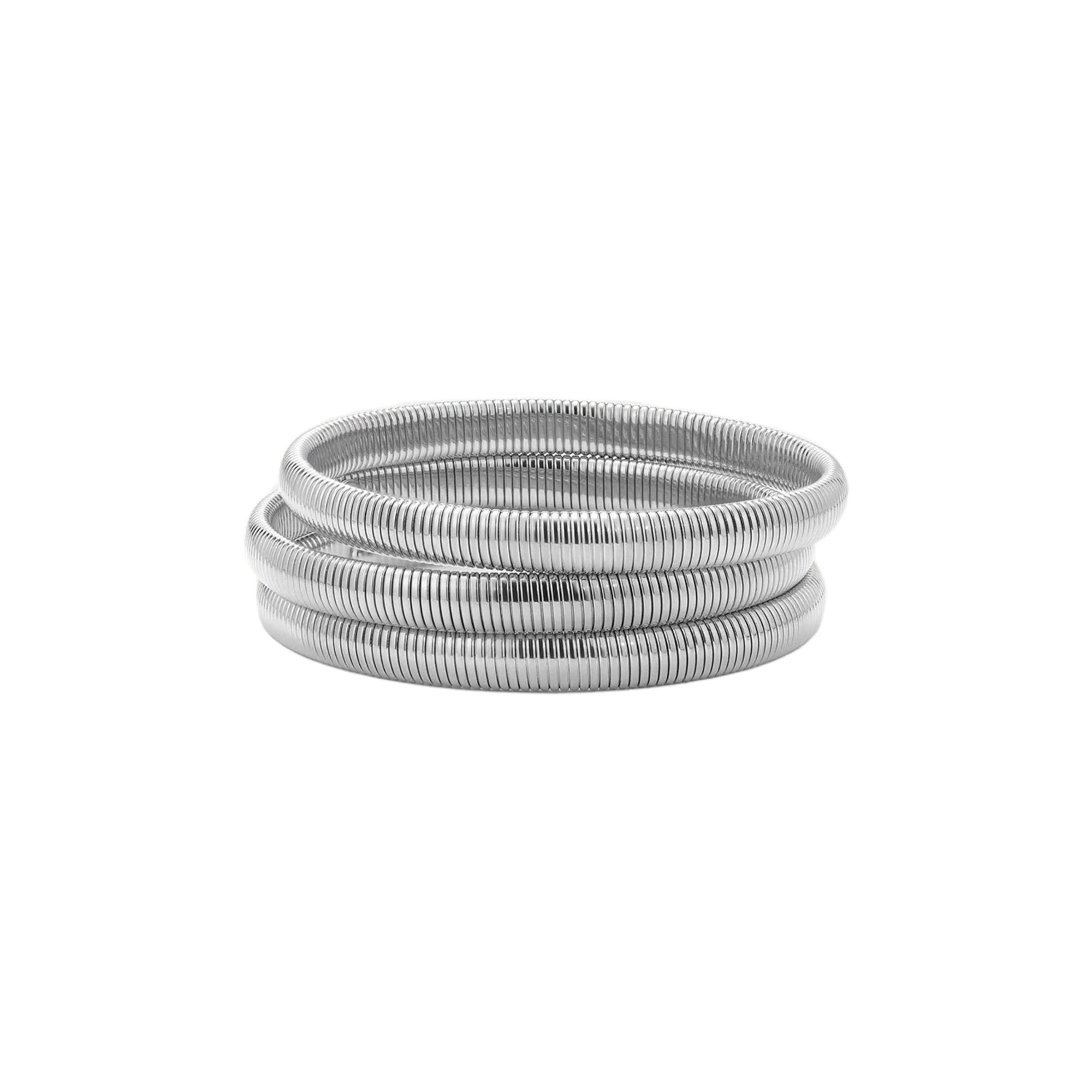 A stack of three coiled silver metal bangles with a textured, ribbed surface, presented on a clean white background.