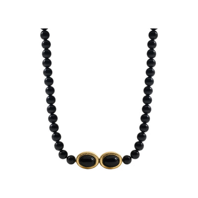 Black agate beaded necklace on white background