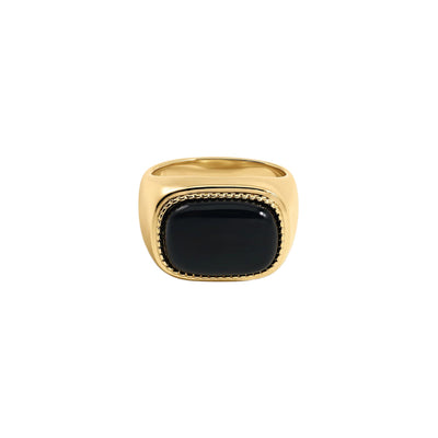 A gold signet ring with a large, polished black cabochon stone, shown against a plain white background.