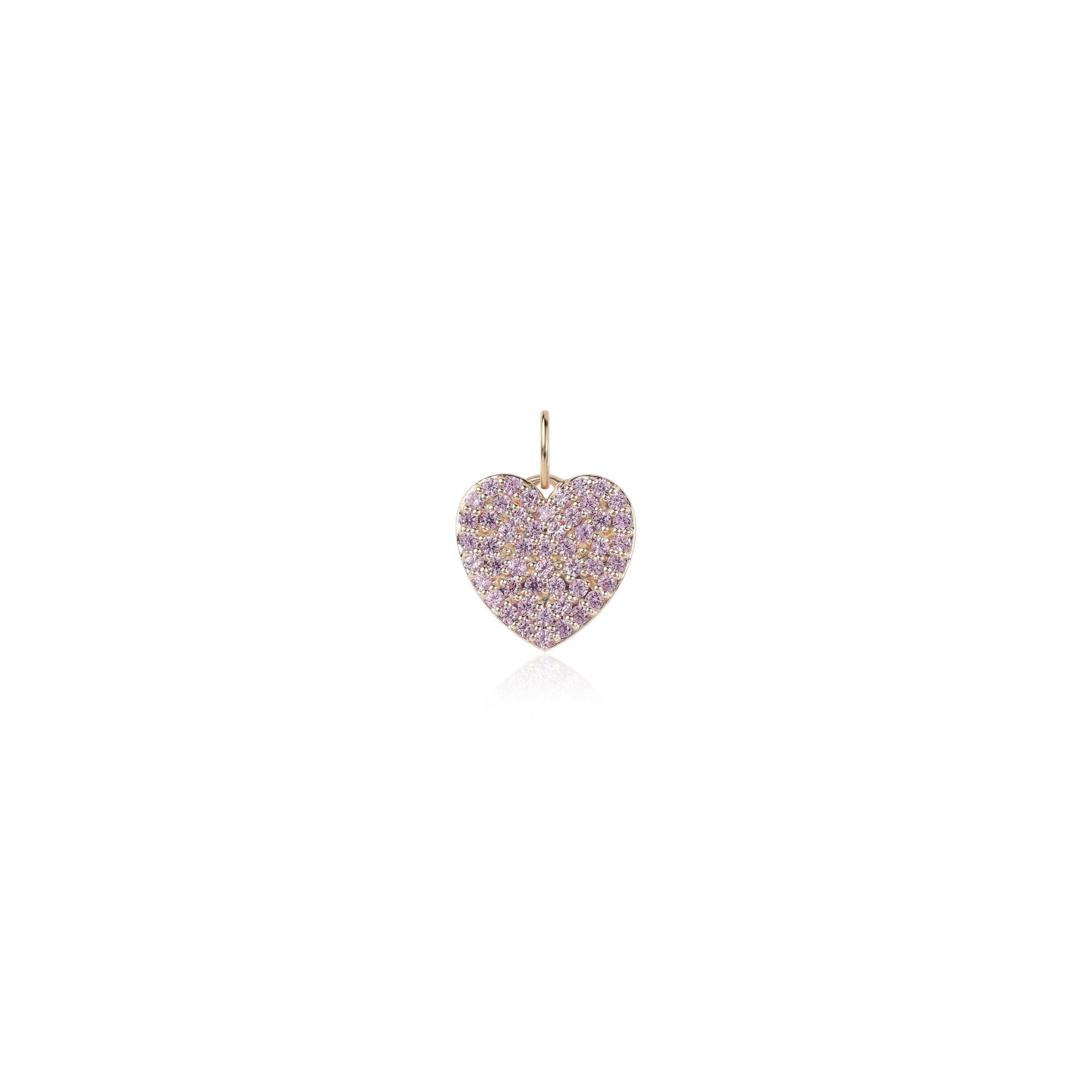 A small heart-shaped pendant covered in pave-set light pink stones with a gold-tone bail, centered on a plain white background.