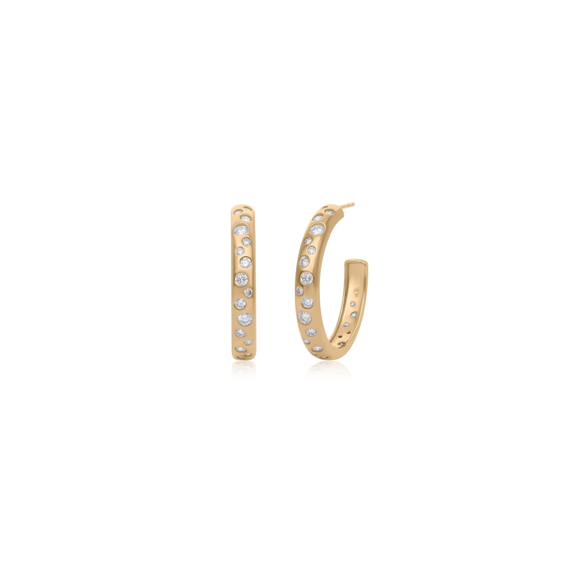A pair of gold hoop earrings with small clear stones set along the front, shown on a plain white background.