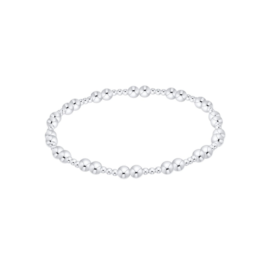 A silver beaded stretch bracelet with alternating polished and textured round beads, displayed on a clean white background.