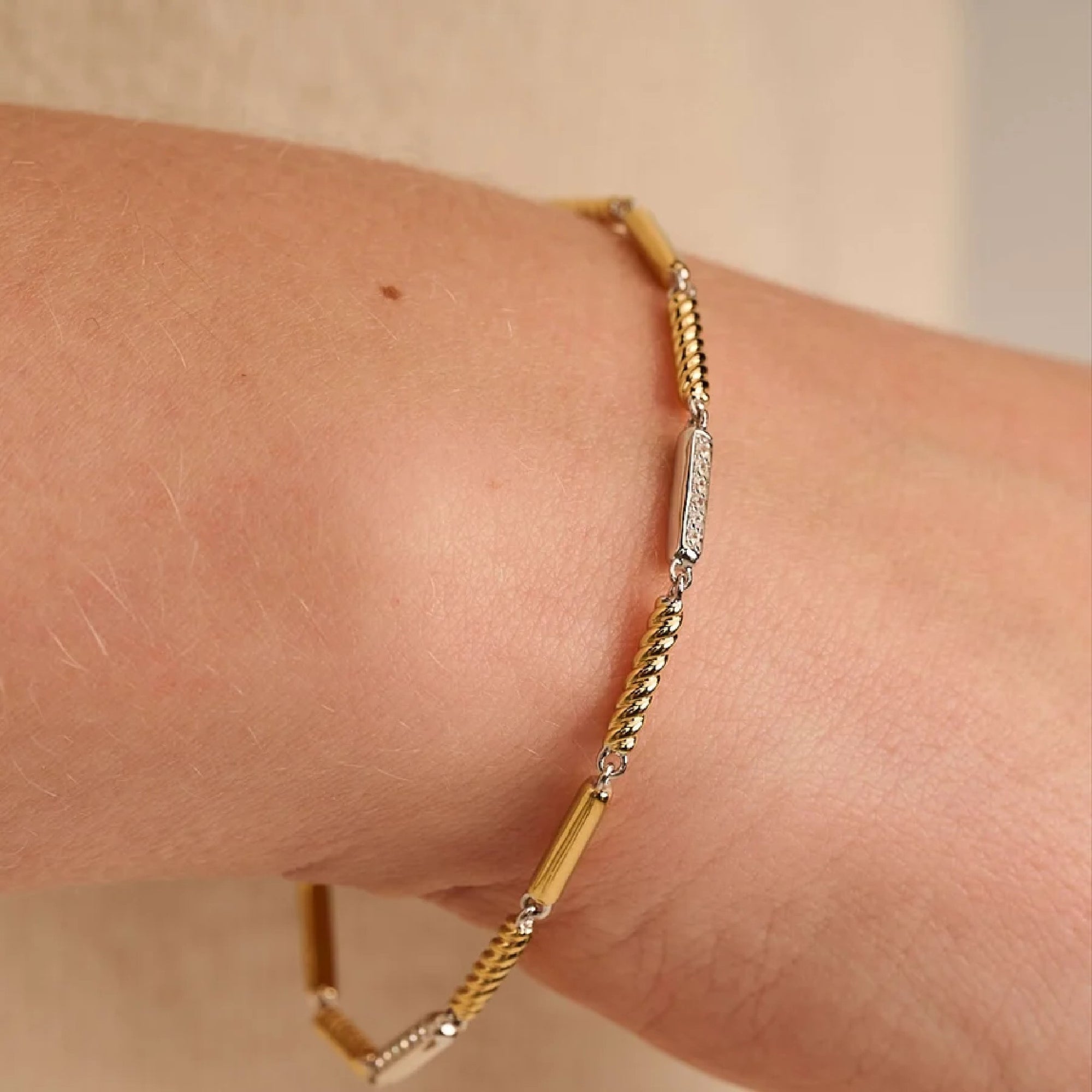 Close-up of Ti Sento bar bracelet links, alternating rope texture and pavé zirconia detail